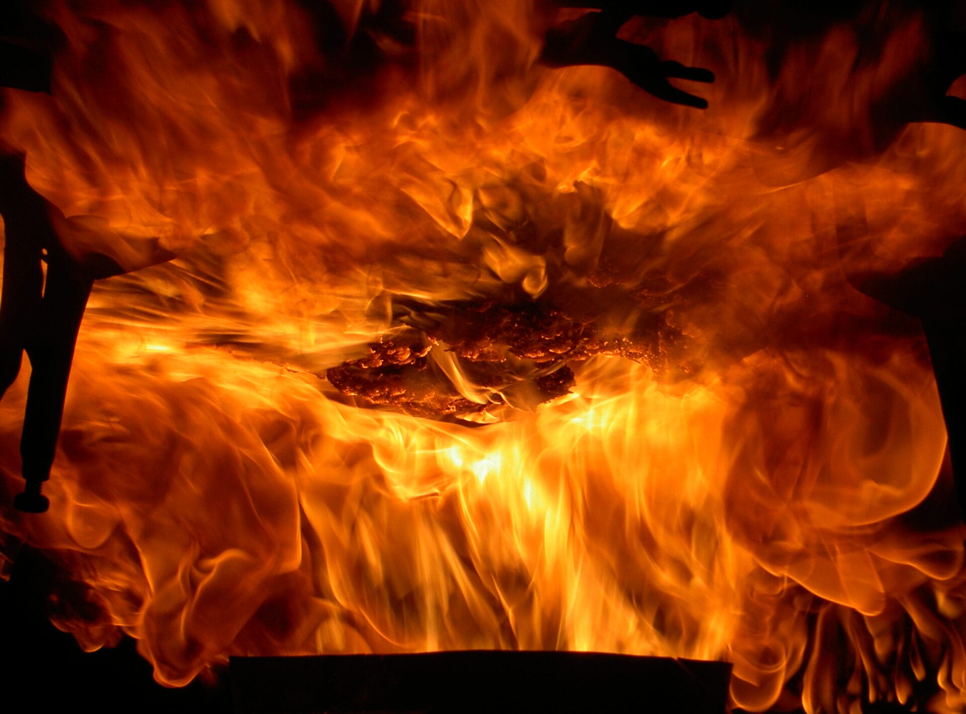 Aircraft component being blasted with fire in flammability testing lab
